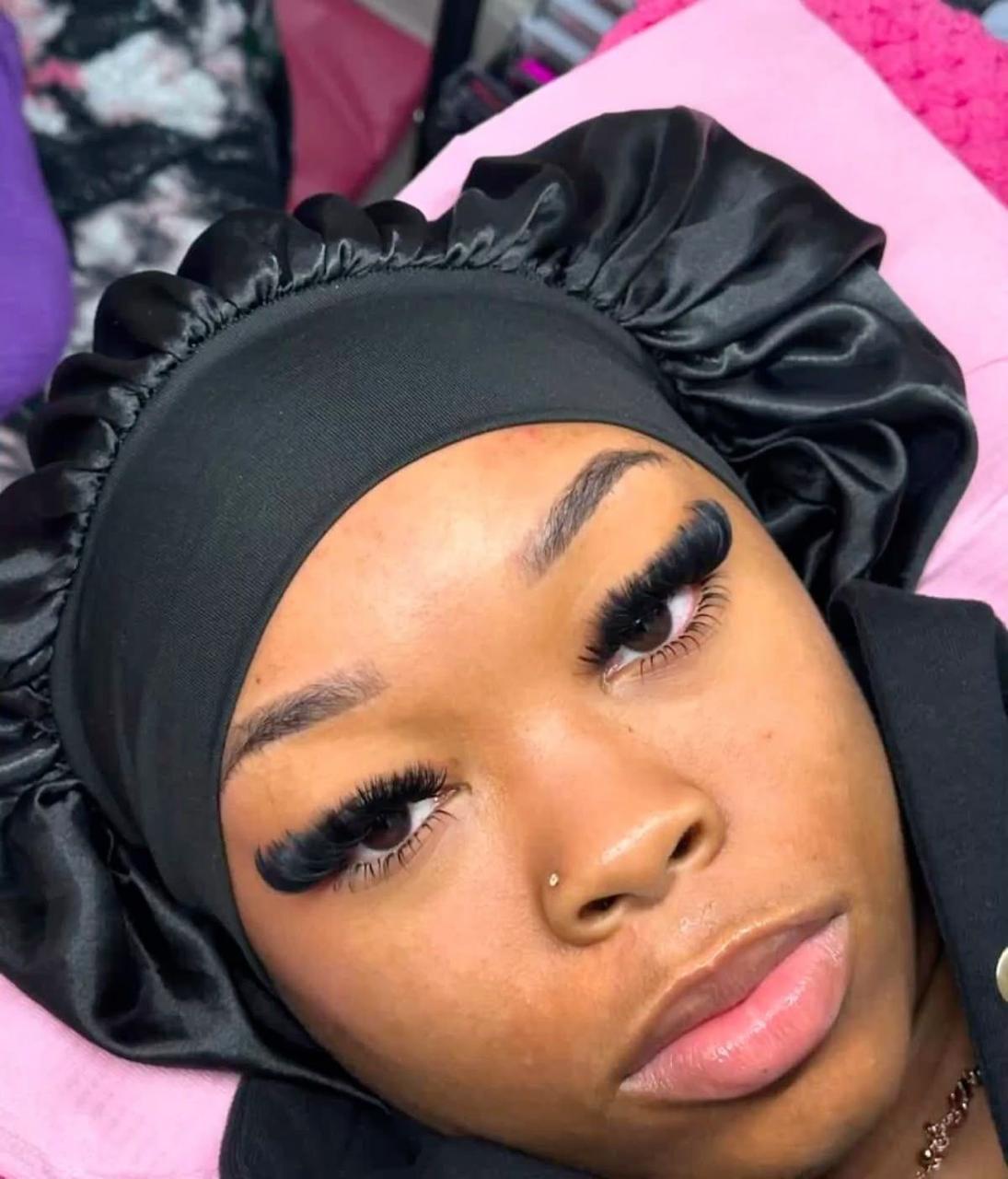 Client showing Hybrid lash extensions by Mia at week two